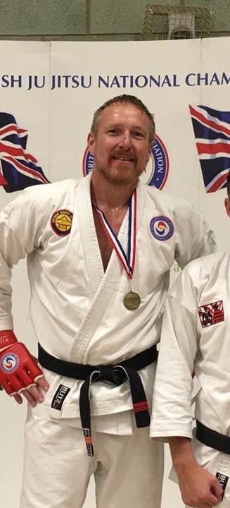Gold medalist in white gi at the British Ju Jitsu National Championships
